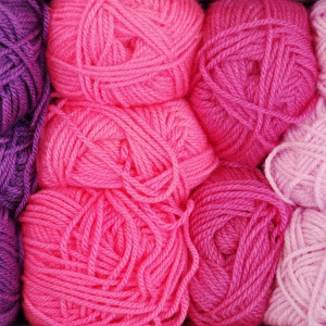 Pile of pink and purple yarn