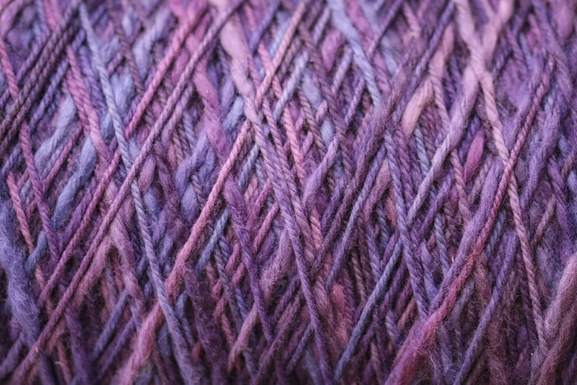 A close up of purple yarn