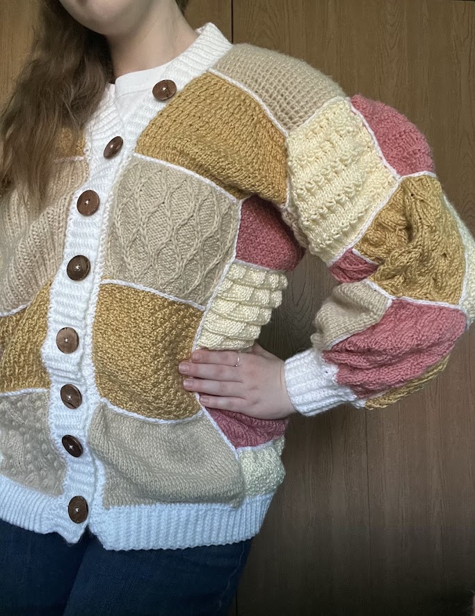 Patchwork Knit Cardigan A patchwork sweater with brown, pink, and yellow squared