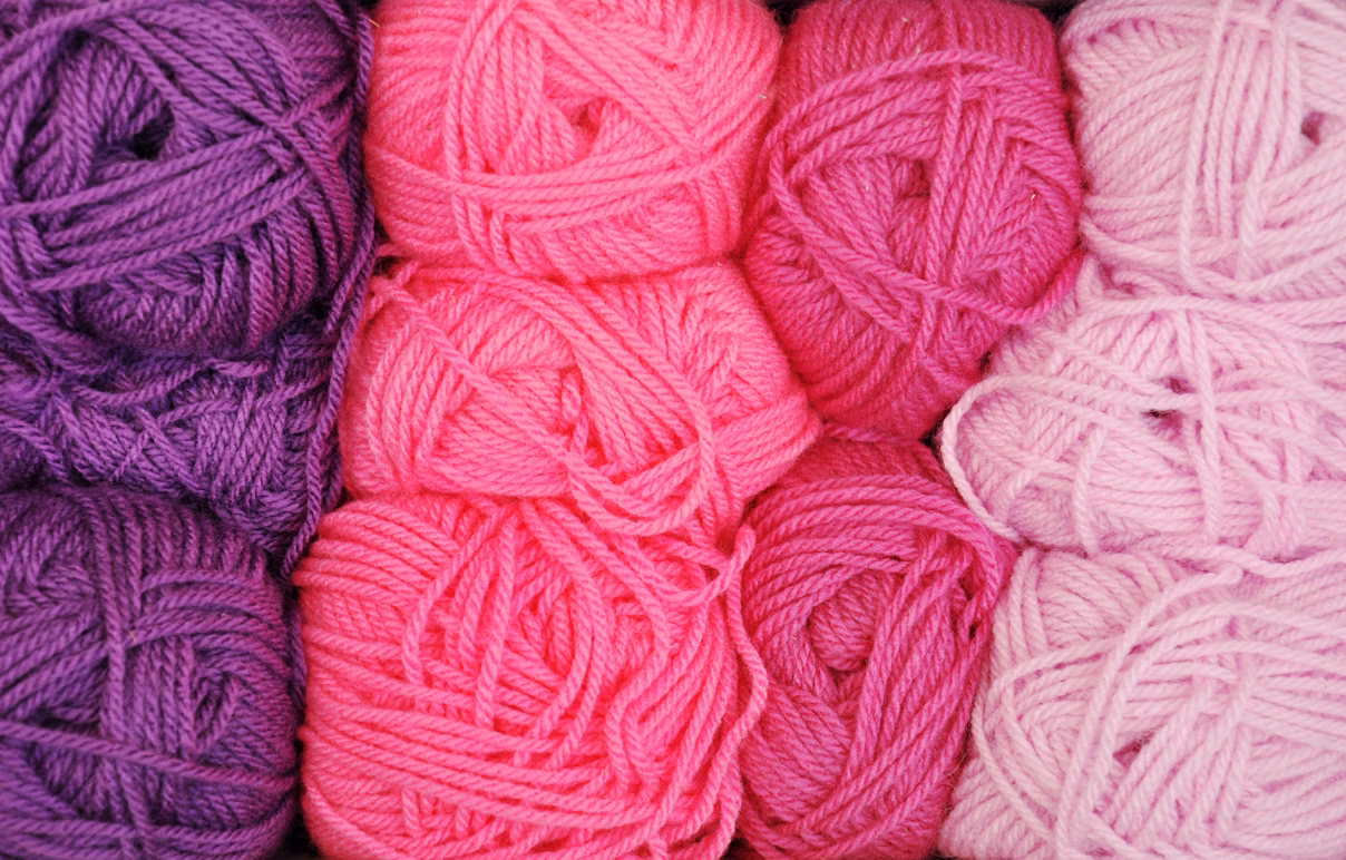 Pile of pink and purple yarn
