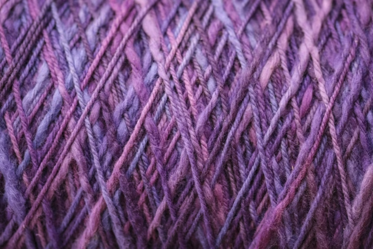 A close up of purple yarn